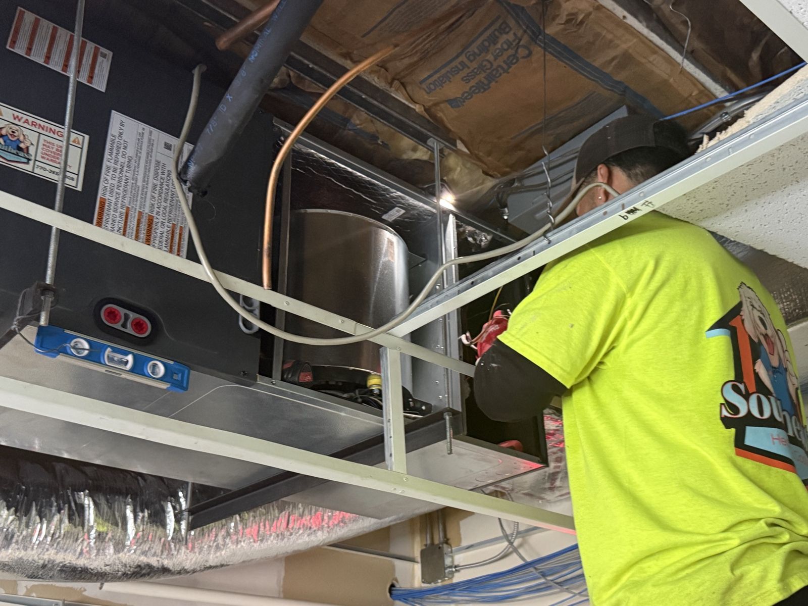 Technician connecting ductwork