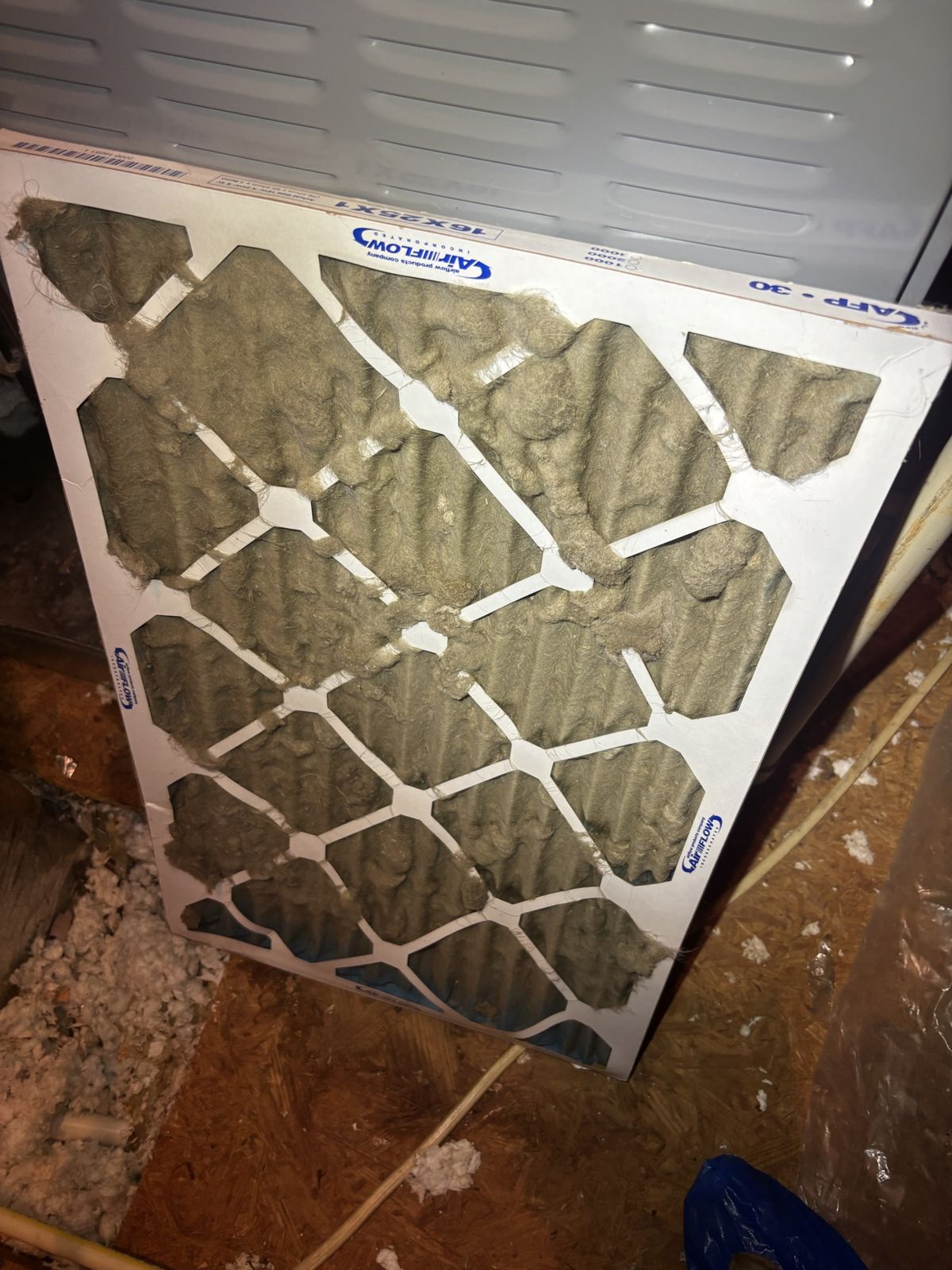 Clogged air filter pulled during a Southeast indoor air quality check
