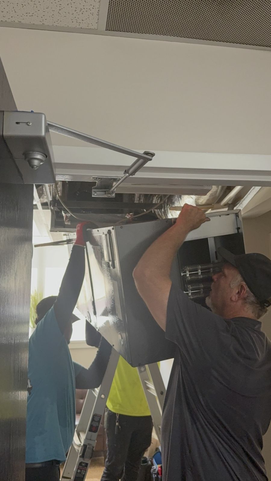 Setting a ceiling-mounted air handler