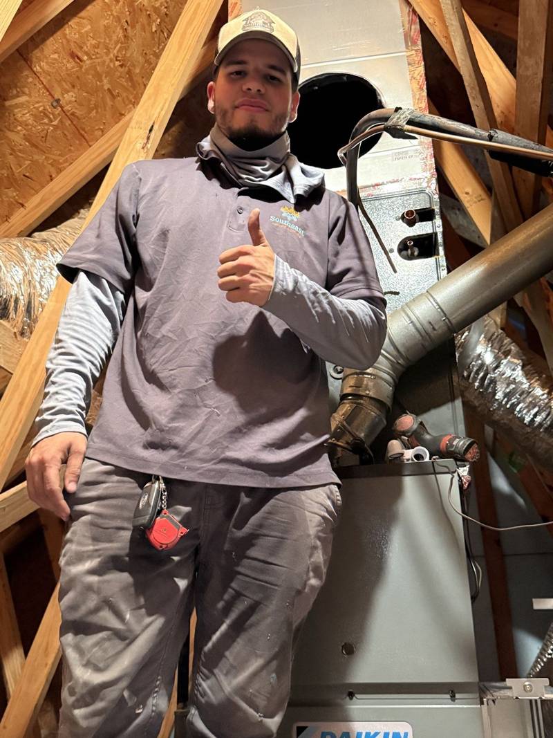 Southeast technician working in an attic