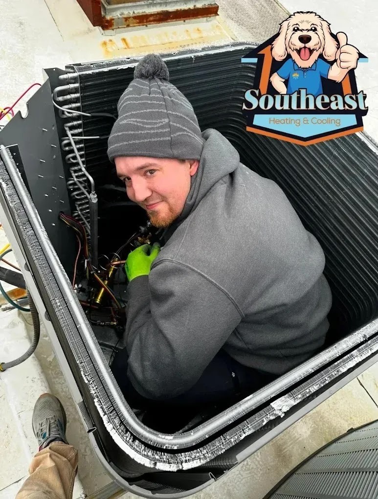 Technician performing routine HVAC maintenance, focusing on safety and detail